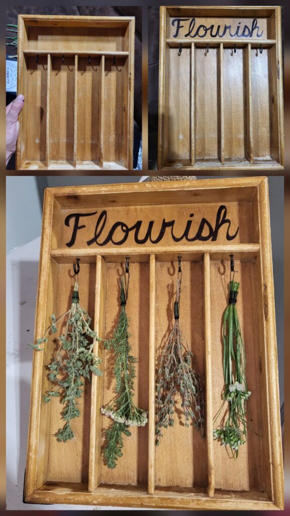 Repurposed and Upcycled! This "Flourish" started as a worn $2 silverware tray from the thrift store. I added the black hooks, the script (with my Sharpie), and the herbs from my garden.